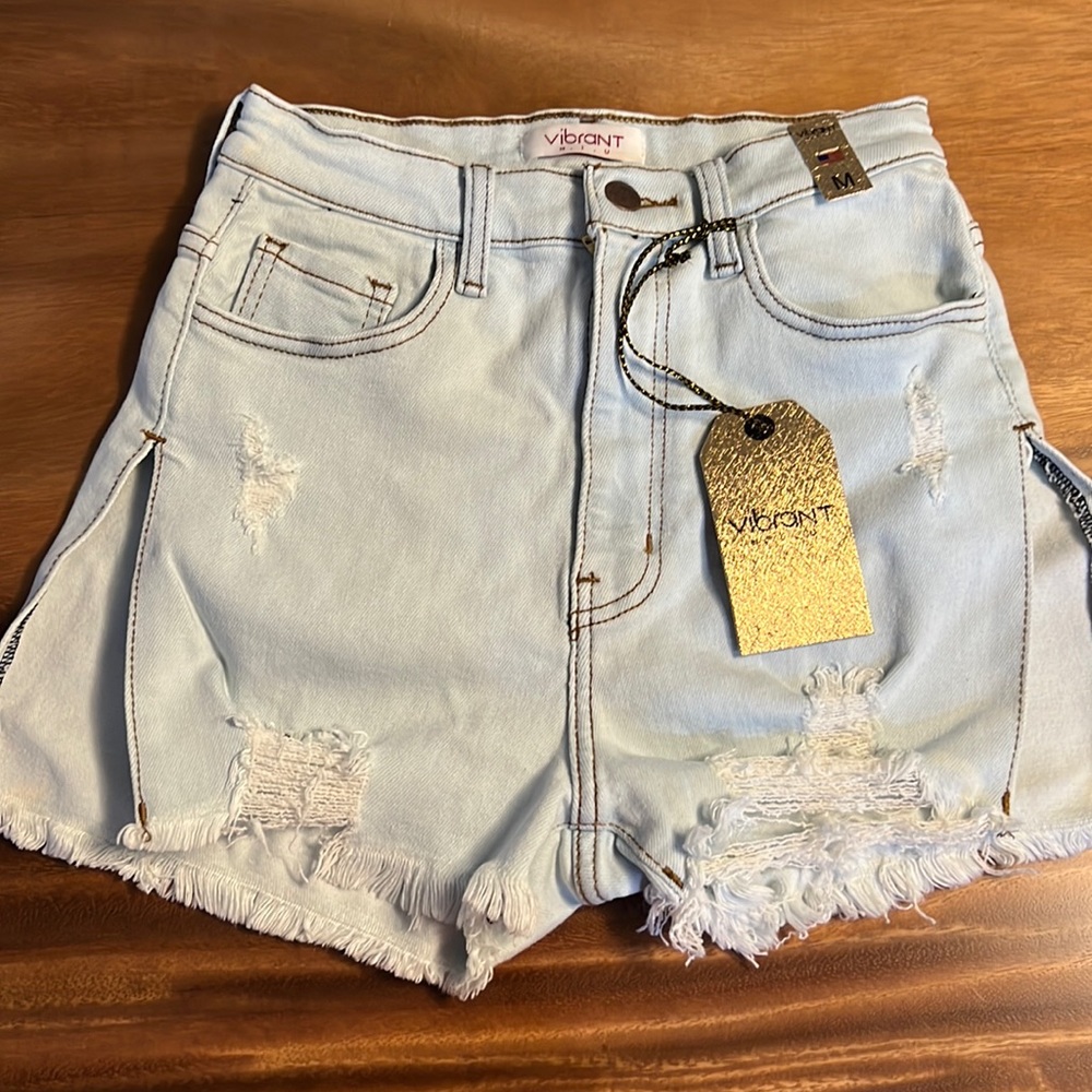 Vibrant MIU Sexy Jean Shorts split sides, raw hem - new with tags size medium.